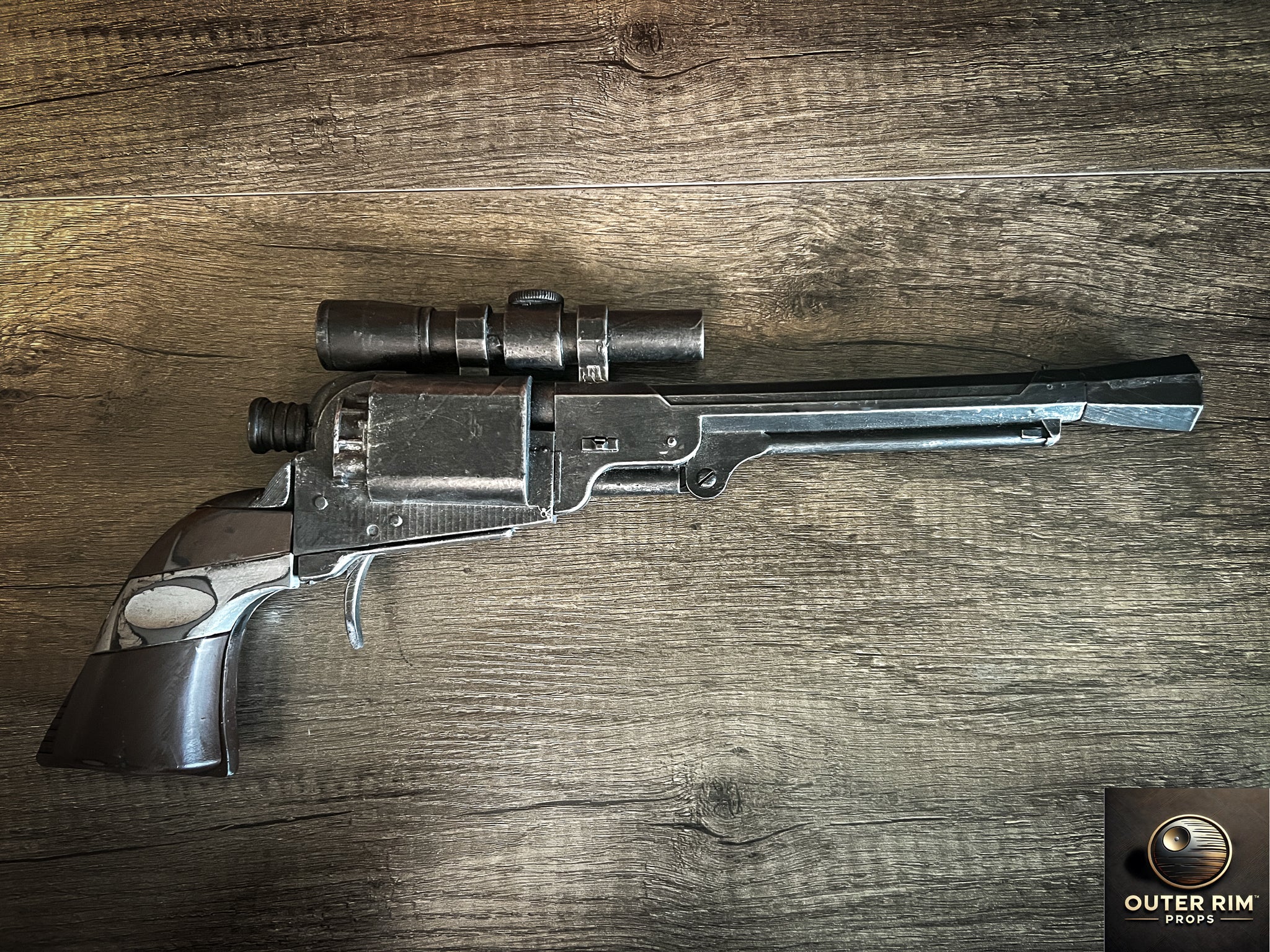 “Reverse side view of Cad Bane LL-30 blaster pistol replica showing grip details and weathered finish.”