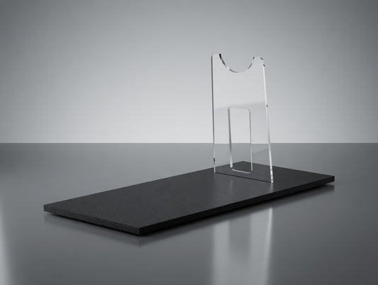 Clear acrylic Leia Defender blaster display stand with textured black base, empty