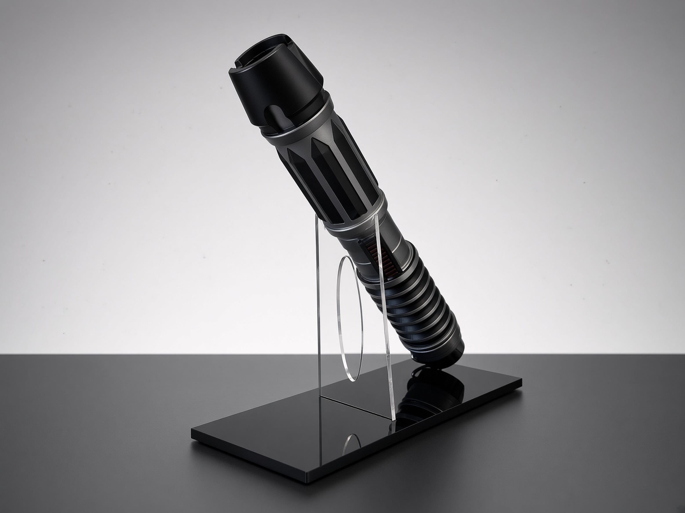 Lightsaber display stand holding saber hilt on polished black acrylic base
