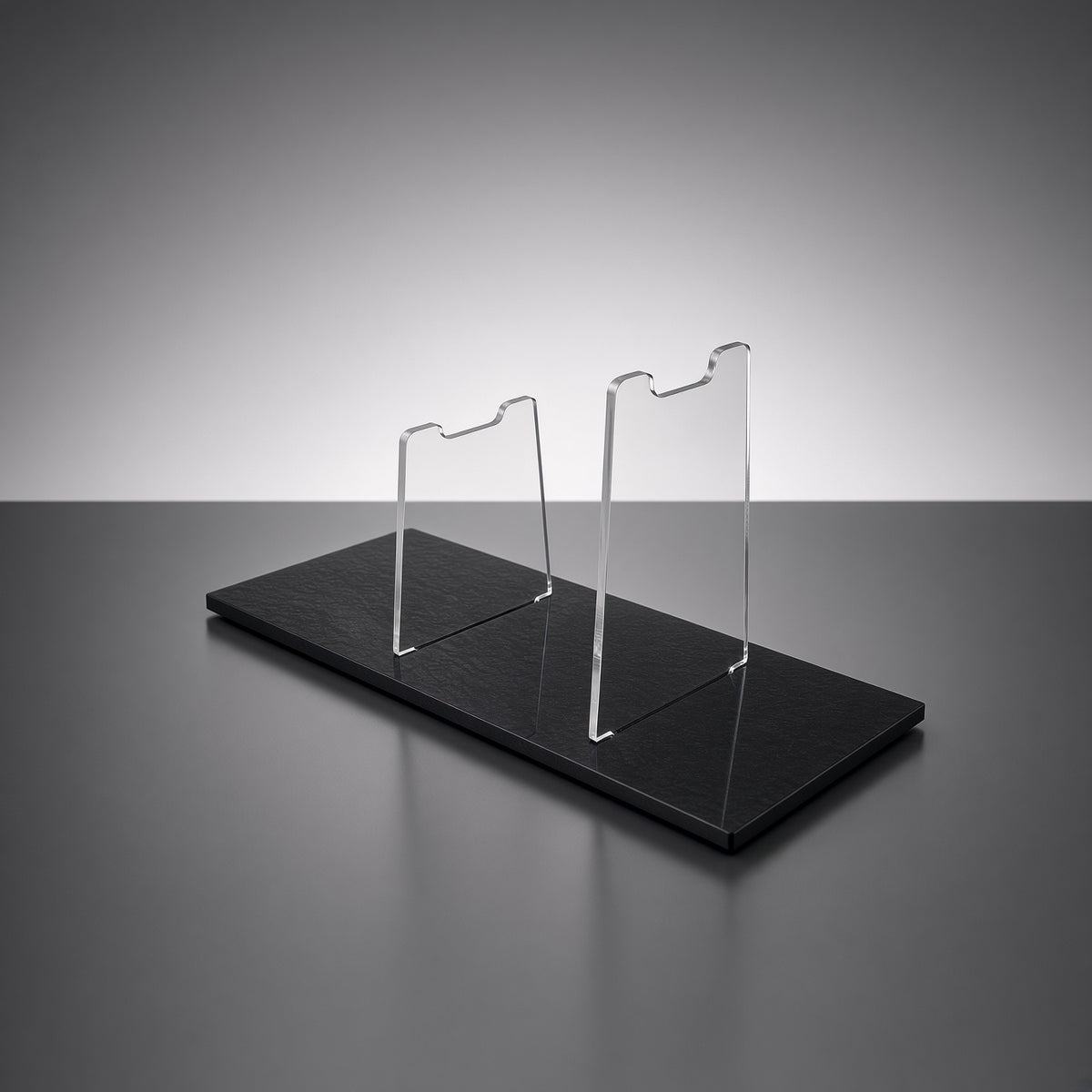 Empty SE-14R blaster display stand, clear acrylic risers on polished black base